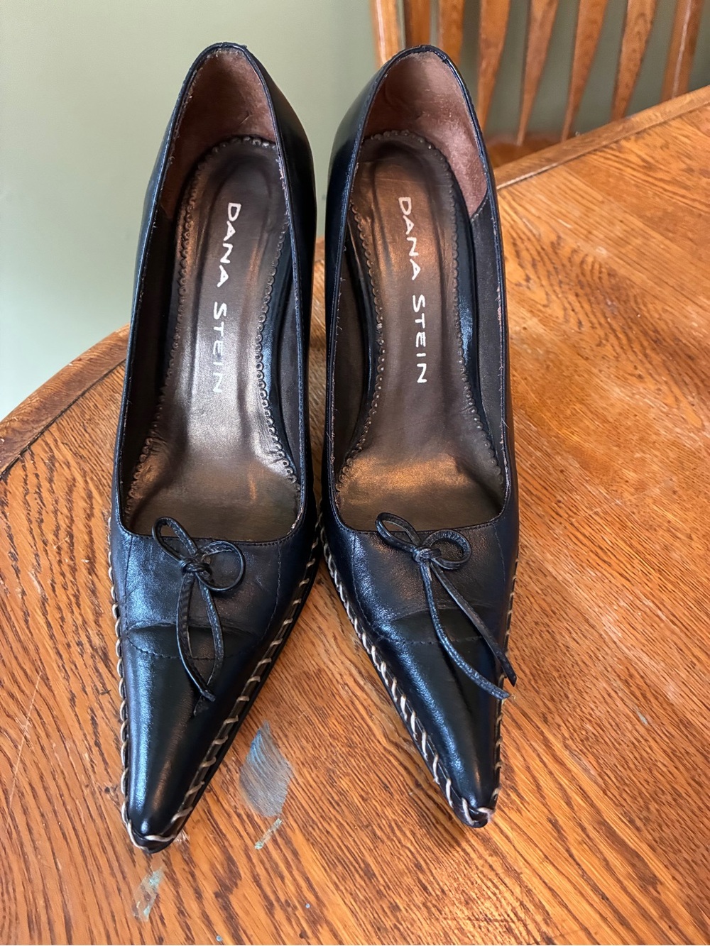 Black Pointed Leather Heels with Bow Accent
